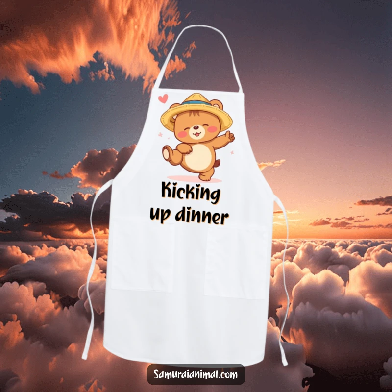 Funny bear cub apron showing a sleepy bear in a straw hat, smiling while attempting a high kick, perfect for kitchen fun.