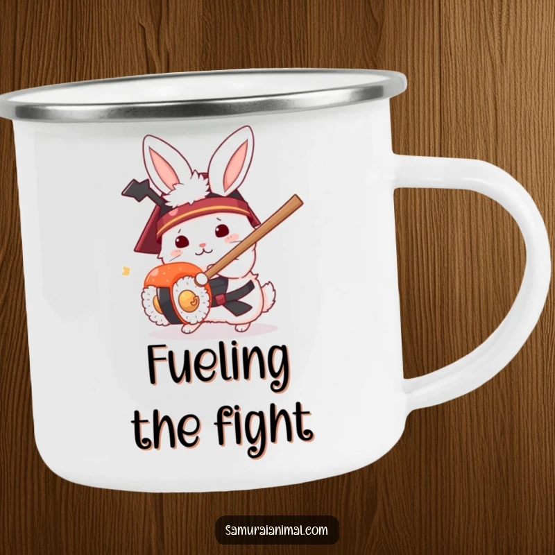 Funny enamel camping mug showing a white rabbit in a samurai helmet humorously fighting a sushi roll with a small sword.