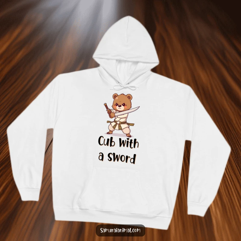Funny hoodie featuring a strong bear cub practicing sword forms with great enthusiasm, embodying courage and playful might.