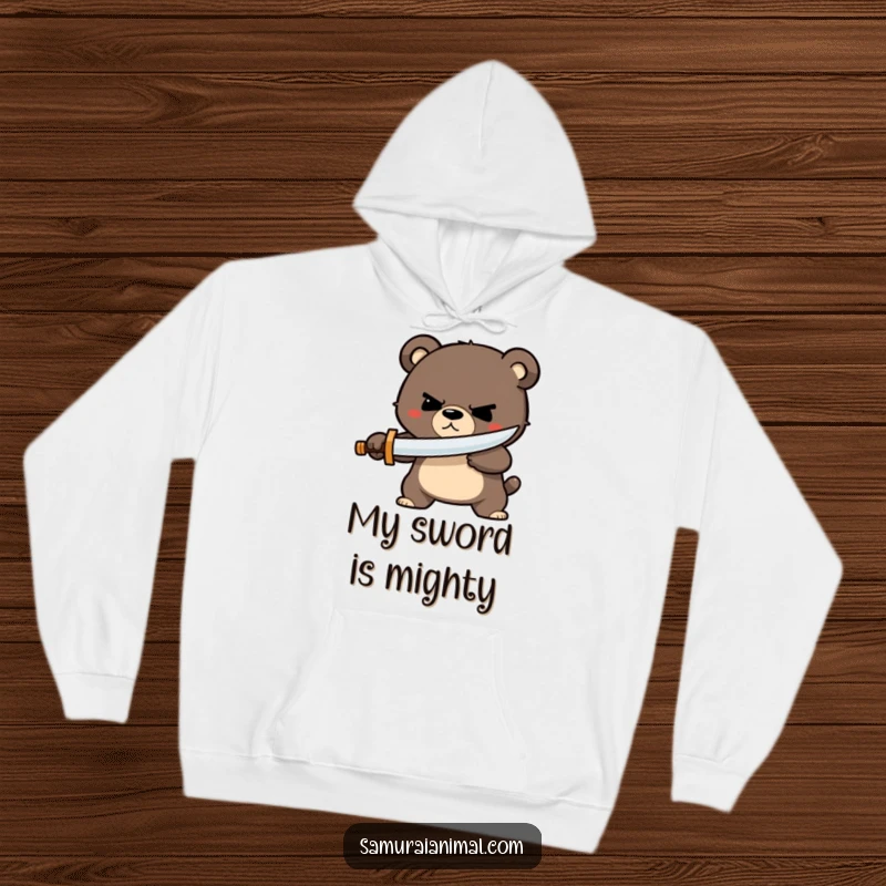 Funny bear sword hoodie showcasing a small bear character with a determined grin, skillfully parrying with a tiny wooden sword, ready for anything.