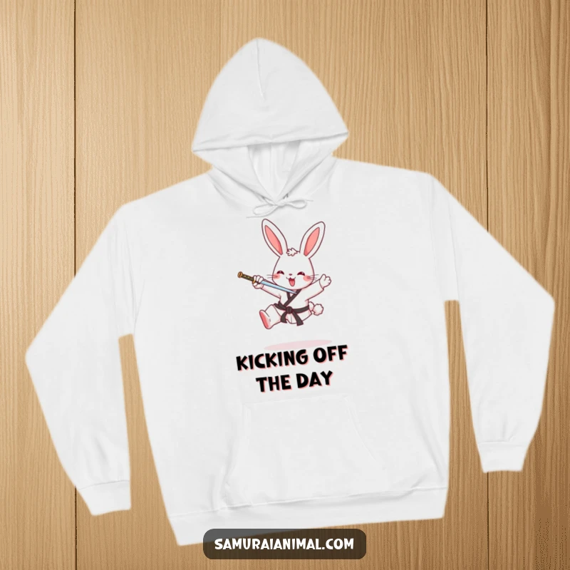 Funny hoodie with a cheerful bunny performing a karate kick, offering warmth and a dose of martial arts humor.