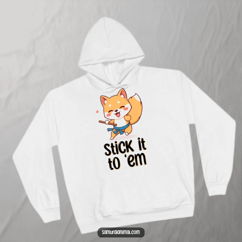 Funny Shiba Inu hoodie showing a playful dog performing a low sweep with a stick, offering cozy warmth and doggy charm.