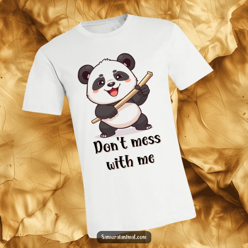 Funny plump panda comically wielding a toothpick sword with a determined grin on a t-shirt, showcasing absurd bravery.